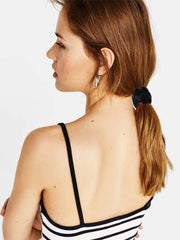 LFOUVRE flat-lay with outfit showing how black scrunchies match many looks