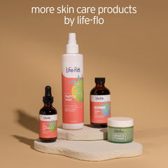 Hand holding Life-Flo bottle to show 8oz scale and travel-friendly size