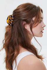 LILIE&WHITE tortoise claw rhinestone detail adding sparkle to hairstyles