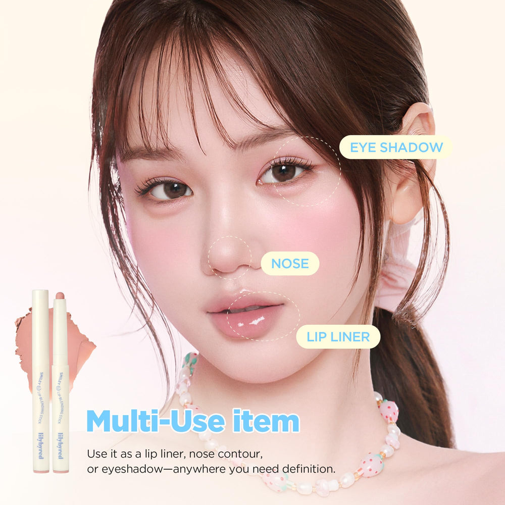 lilybyred pencil next to fingers showing compact travel-friendly scale