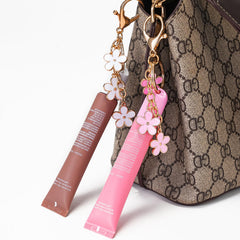 Limpskys cap clipped to purse zipper in daily use, convenient touch-ups