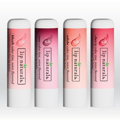 Lip Naturals balm next to a coin demonstrating compact, travel-friendly size
