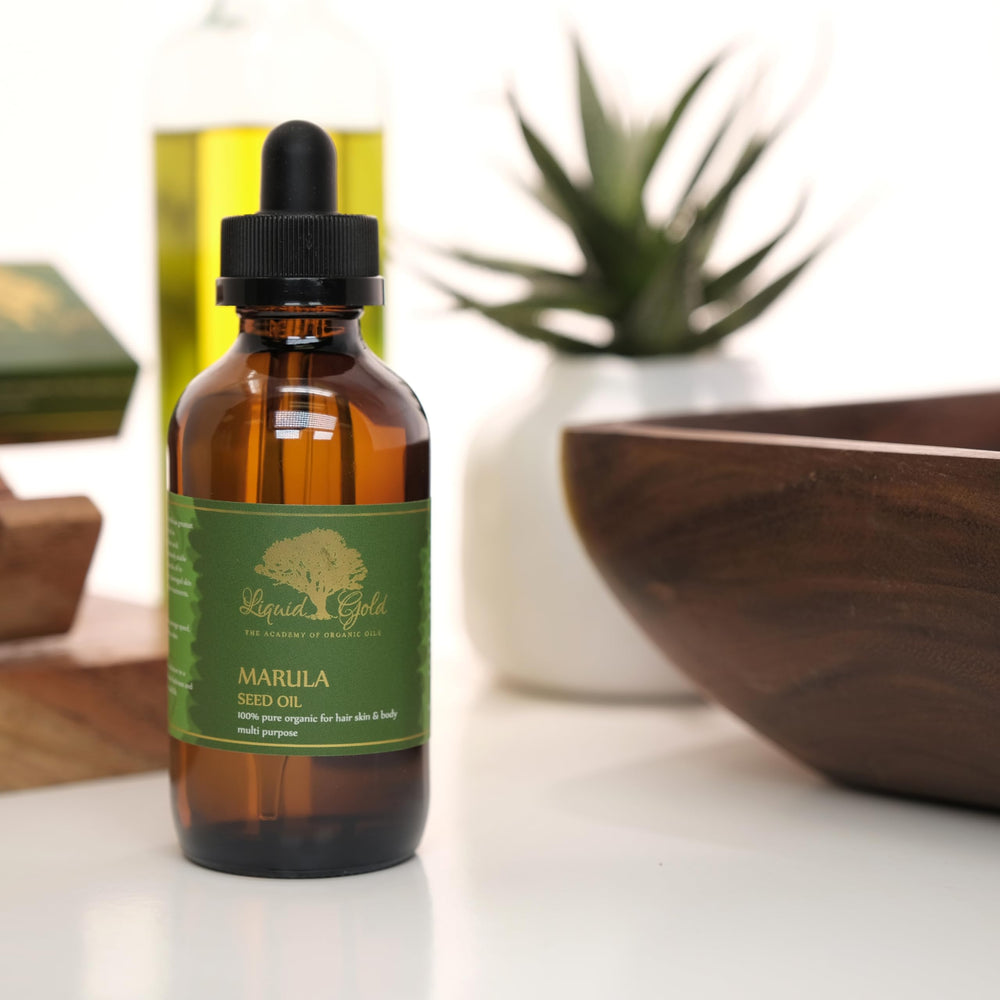 Liquid Gold Inc dropper releasing a precise drop for controlled application benefit