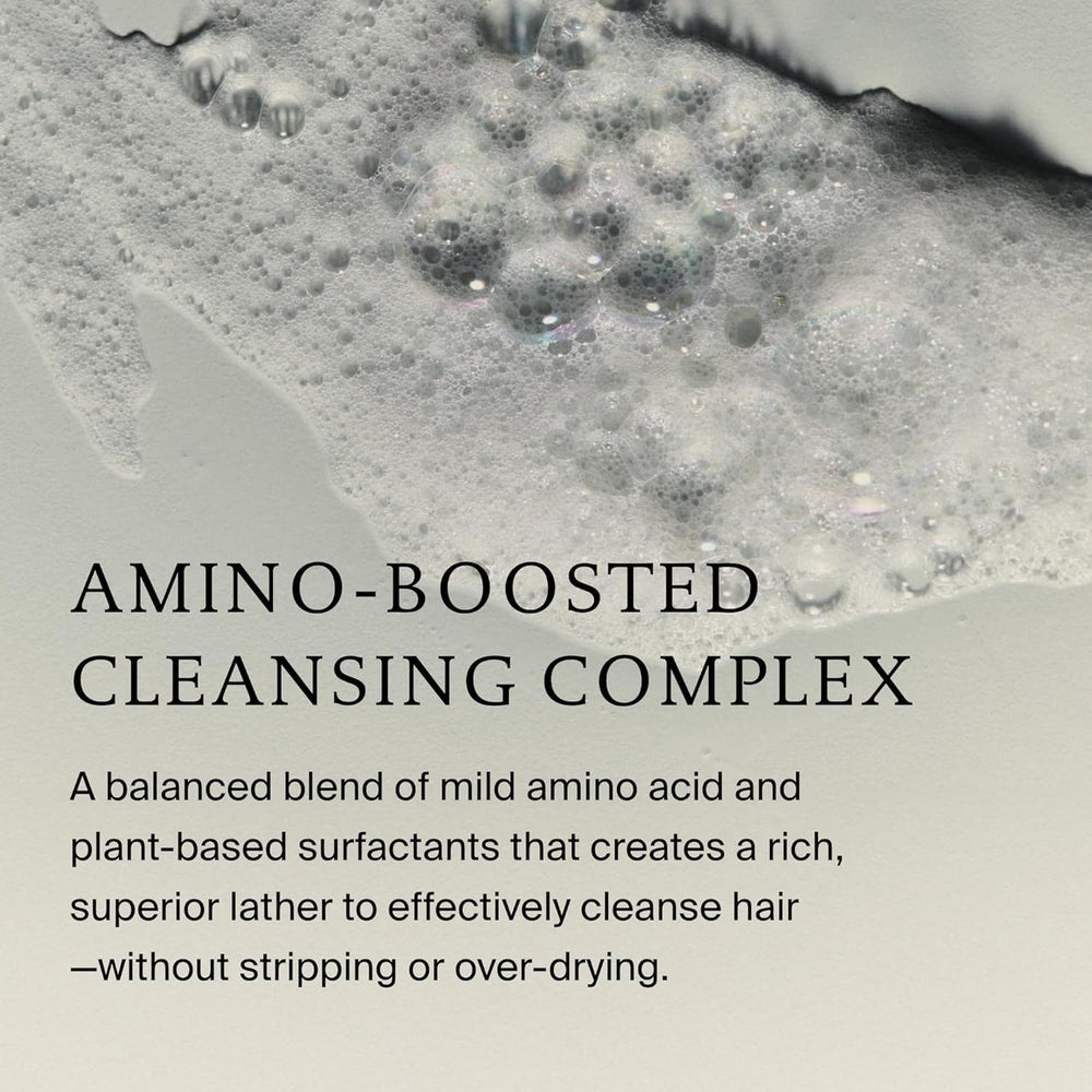 Living Proof shampoo in bathroom setting conveying everyday use and freshness