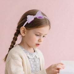 Lizioo child wearing headband in lifestyle scene showing playful style