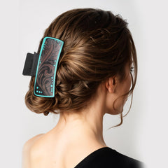 LLOUSSAK clip worn in half-up hairstyle showing reliable hold