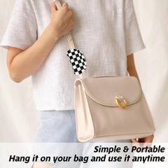 LLOUSSAK clips attached to travel bag illustrating portable hair accessory convenience
