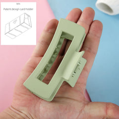 Loanzeg clip held in hand for scale showcasing the 4.1-inch size and comfortable fit