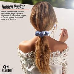 LokiStashed scrunchie beside a key to show pocket scale and practical storage capacity