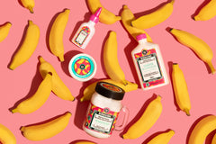 Hand applying Lola hair butter to ends, demonstrates nourishment and control benefit