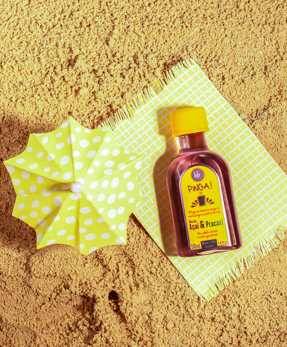 Lola Pinga bottle held in hand demonstrating travel-size convenience benefit