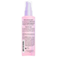 L'Oreal Paris bottle on bathroom shelf styled with plants, suggests daily routine use