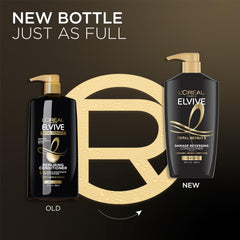 L'Oreal Paris Elvive bottle in hand to show 28 oz size for value and scale