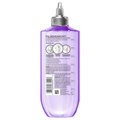 L'Oreal Paris Wonder Water size comparison next to hand showing travel-friendly 6.8 fl oz