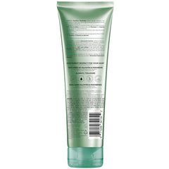L'Oreal Paris bottle on bathroom shelf conveying salon-quality routine