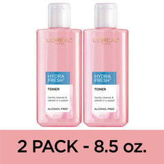 L'Oreal Paris bottle held in hand showing actual size and travel friendliness