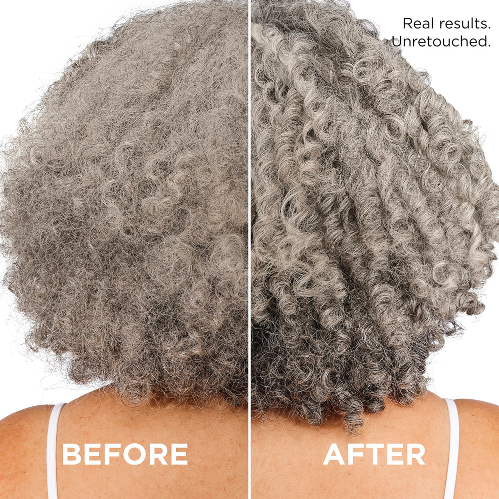 L'Oreal Paris conditioner being applied in shower to detangle curls