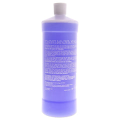 Lottabody bottle held in hand to show 32 oz scale and convenience for salon use