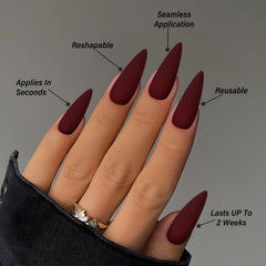 LoveOurHome hand next to coin showing long stiletto length for scale and impact