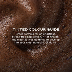 Loving Tan mousse on applicator mitt for streak-free blending