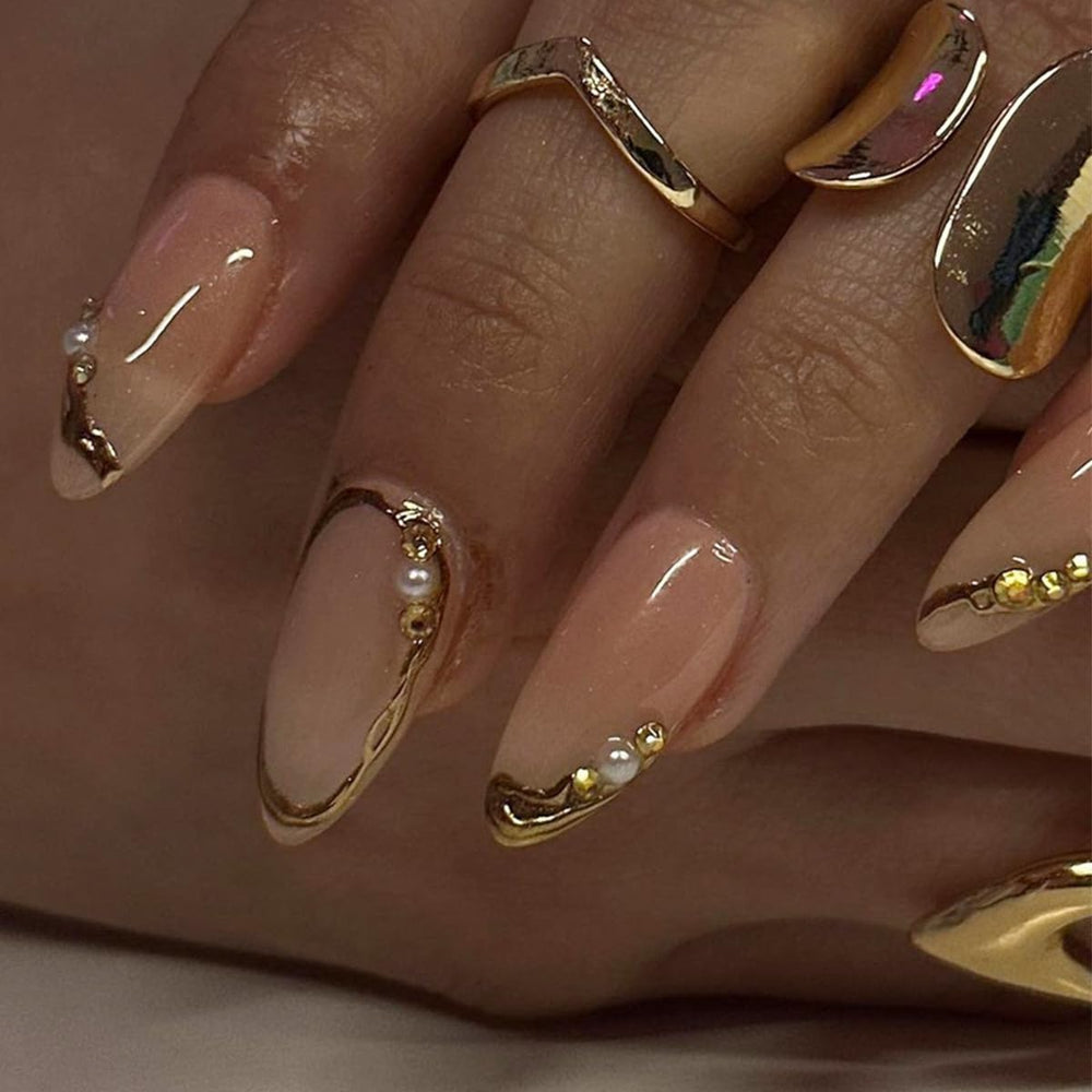 LRKNNO close-up of gold French tip and 3D pearl accents for elegant look
