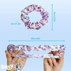 LUV HER Bluey set held in a child’s hand demonstrating compact size and travel-friendly convenience