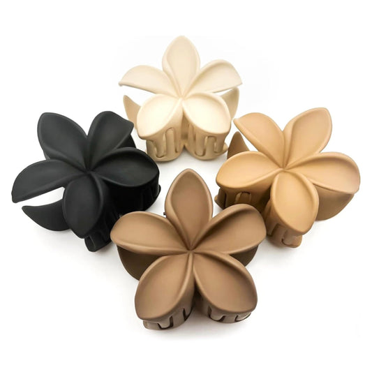 Luvearo front view of four plumeria clips showing matte finish and floral shape for style