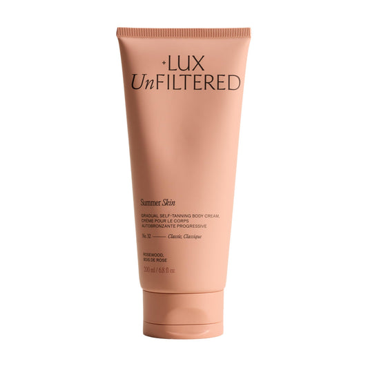 Lux Unfiltered front bottle showing product and branding, highlights natural glow