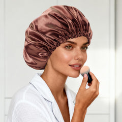 Luyfrsuu bonnet held in hand for scale illustrating generous size and coverage