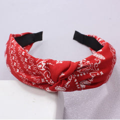 Lvyeer headband next to hand to show size and portable convenience