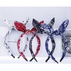 Lvyeer headband held in hand for size comparison showing compact, lightweight design