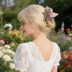 LYLYNB clip held in hand showing scale and lightweight comfort for all-day wear benefit