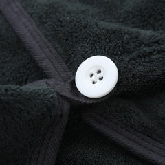 M-bestl towel next to ruler showing 25 x 65 cm size for fit clarity