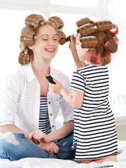 MADHOLLY clip holding bangs in place during styling, crease-free styling benefit