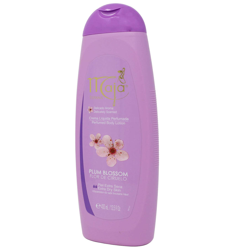 Maja bottle with plum flowers prop highlighting floral-fruity scent benefit