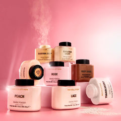 Makeup Revolution powder jar in hand illustrating 1.12 oz size and portable convenience