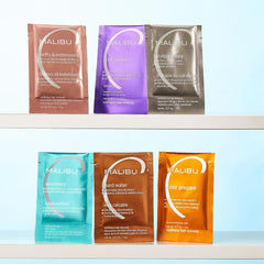 Malibu C packet size compared to swim cap showing travel-friendly portability