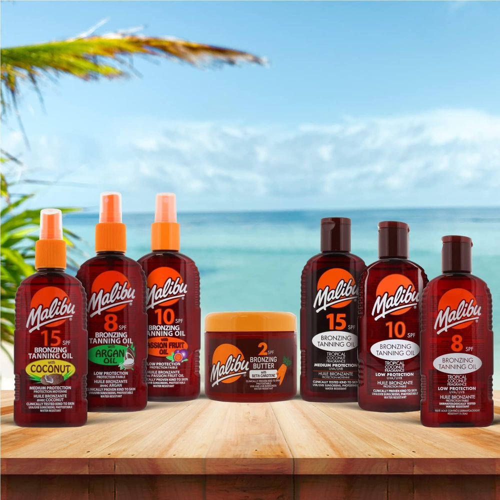 Malibu tanning oil in a beach setting showing travel-friendly hydration