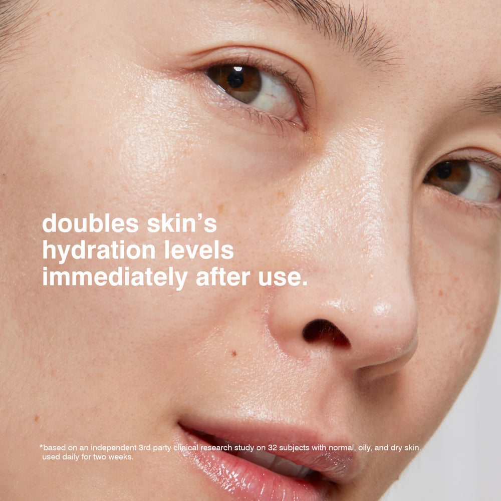 MALIN+GOETZ applying cream to cheek illustrating quick absorption