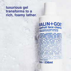 MALIN+GOETZ foamy texture on fingertip showing gentle cleansing action