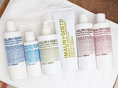 MALIN+GOETZ on bathroom counter in lifestyle scene suggesting daily use