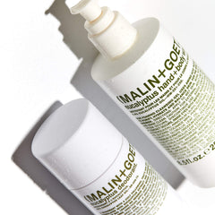 MALIN+GOETZ bottle in bathroom lifestyle scene enhancing modern decor