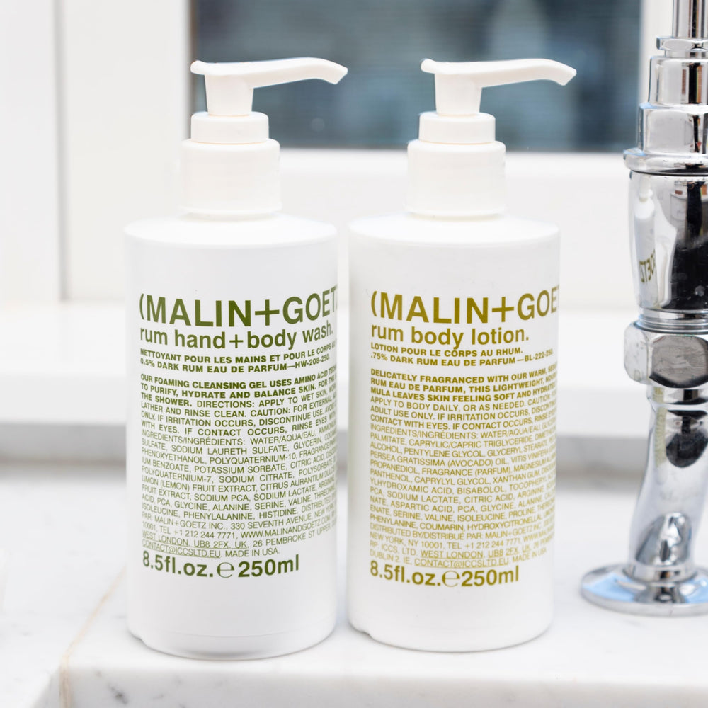 MALIN+GOETZ bottle placed on bathroom shelf suggesting daily routine convenience