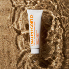 MALIN+GOETZ sunscreen texture close-up demonstrating lightweight, non-greasy spread