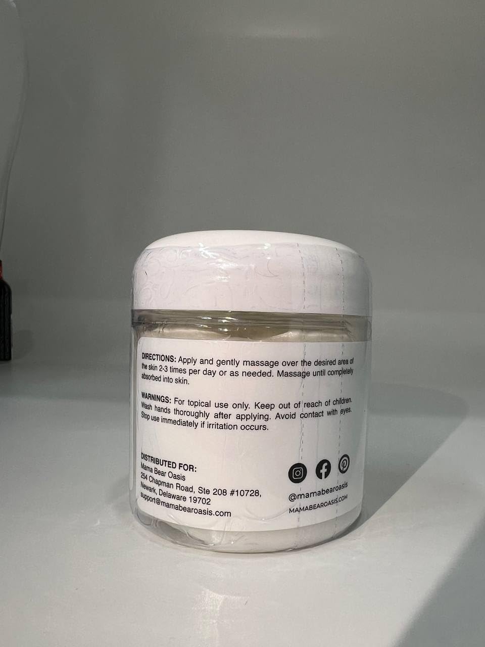Mama Bear Oasis being applied to foot for targeted topical use