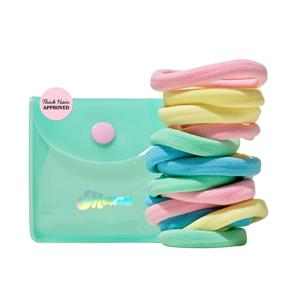 Mane front packaging showing colorful hair ties and travel case for organized storage
