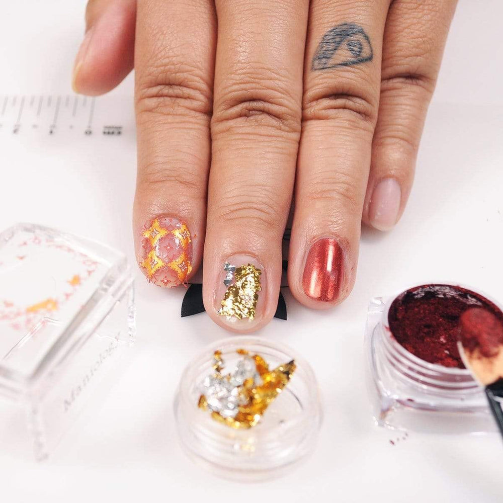 Maniology brush close-up displaying thin, even application for precise nail art