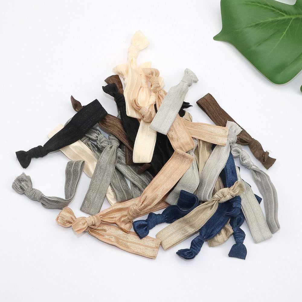 manipepe hair ties beside ruler shows size and fold-over length benefit
