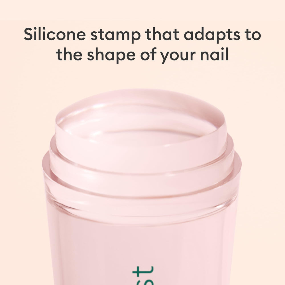 Size comparison of Manucurist stamper next to fingers for handheld control