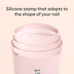 Size comparison of Manucurist stamper next to fingers for handheld control